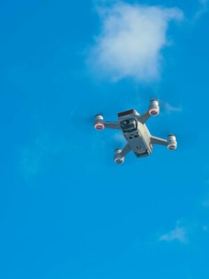 White uav with spinning motors in air